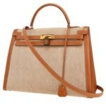Hermès Kelly 35 cm handbag in gold Chamonix leather and beige canvas