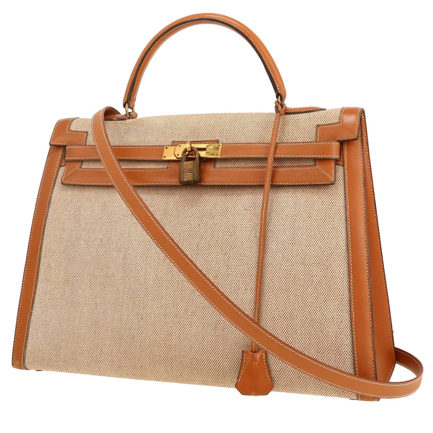 Hermès Kelly 35 cm handbag in gold Chamonix leather and beige canvas