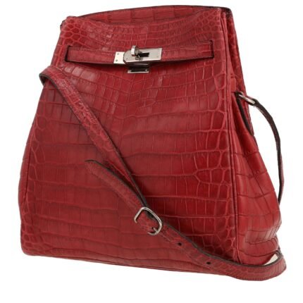 Hermès Kelly Sport handbag in raspberry pink niloticus crocodile